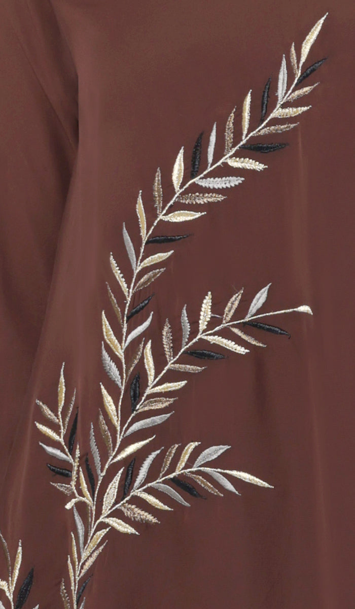 Embroidery details of Baraka tunic in Cocoa.