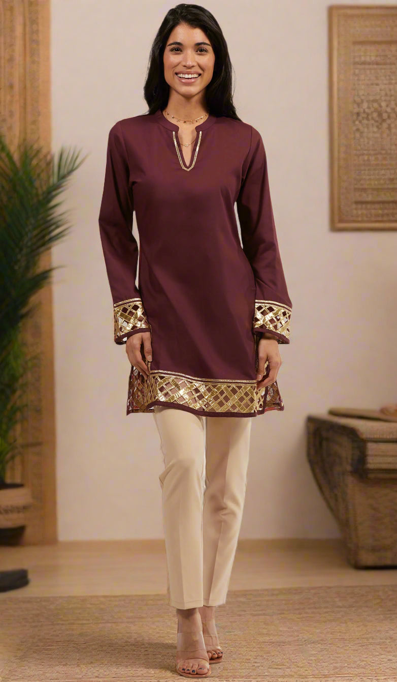 Smiling woman wearing modest Behnaz tunic in Orchid with khaki pants and heels.