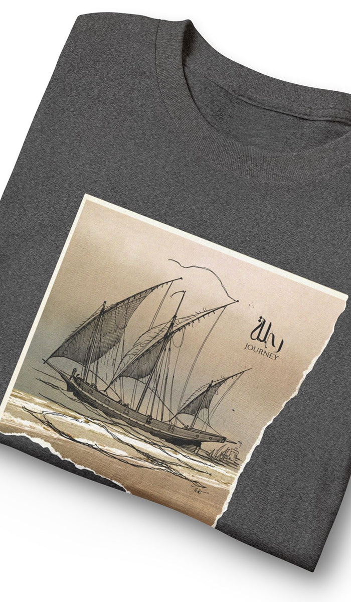A folded dark gray t-shirt featuring a large graphic print of a vintage sailing ship on a beige torn-paper style background.