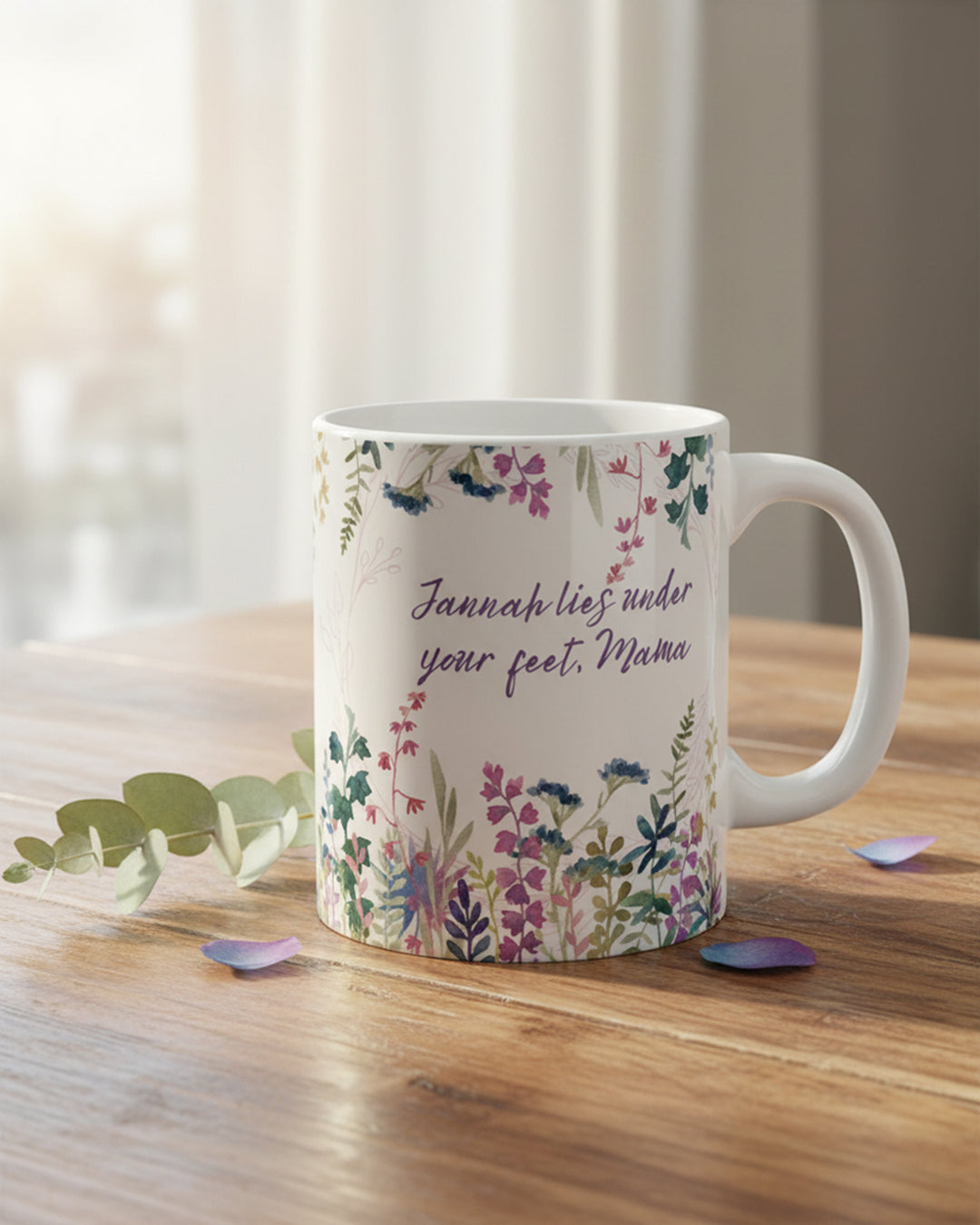 Mug with floral design and text on a wooden surface