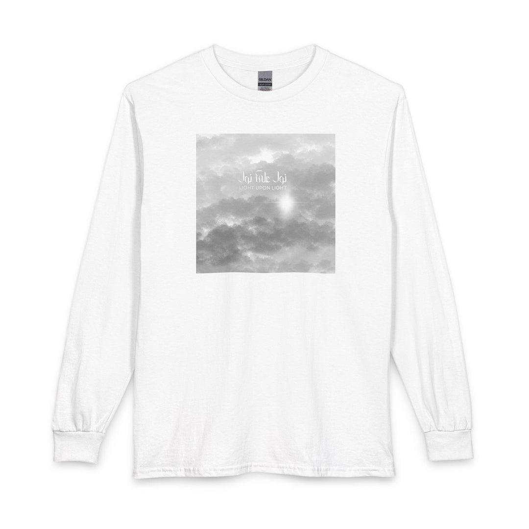 A white long-sleeve crewneck t-shirt featuring a square grayscale graphic print on the chest depicting clouds and Arabic Calligraphy