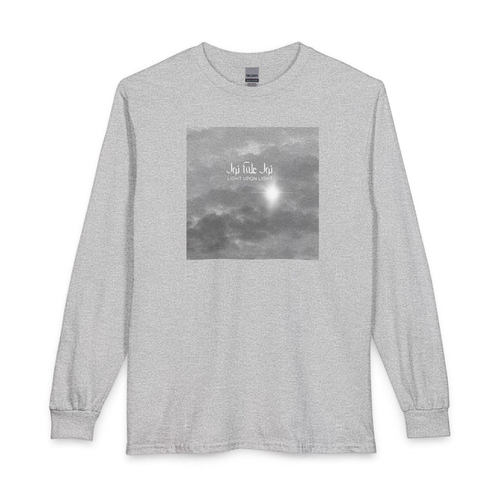 A gray heather long-sleeve crewneck t-shirt featuring a square grayscale graphic print on the chest depicting clouds and Arabic Calligraphy