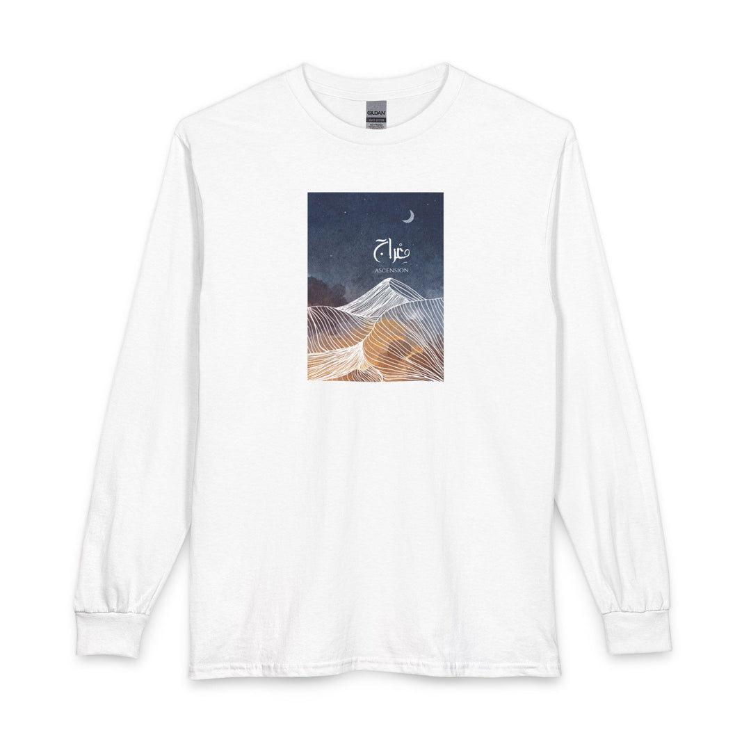 A white long-sleeve crewneck t-shirt with a rectangular graphic print on the chest. The graphic features a dark blue night sky with a crescent moon and the word 'Elko' in white script, above a stylized desert dune illustration in shades of blue, white, and gold.