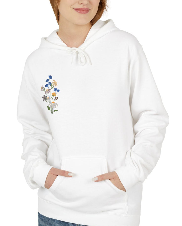 Person wearing a white hoodie with a colorful design on a white background