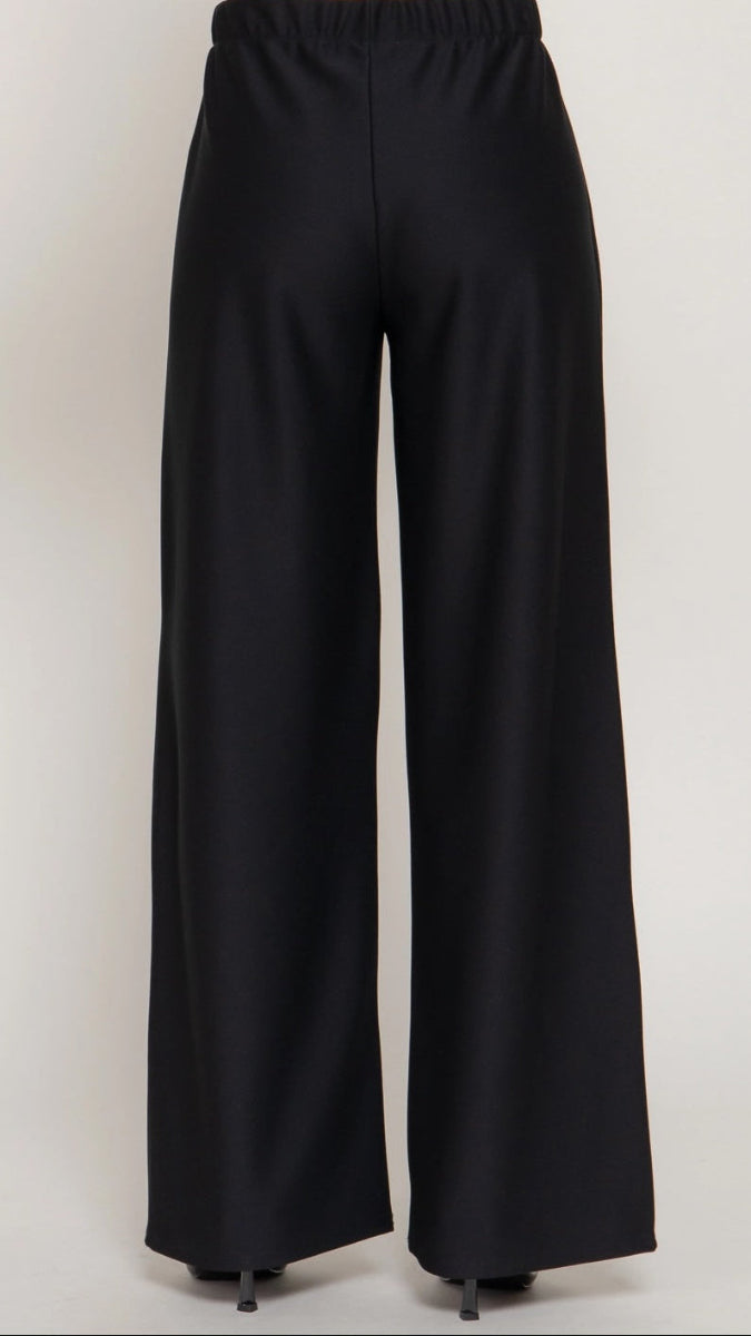 Black wide-leg pants on a white background