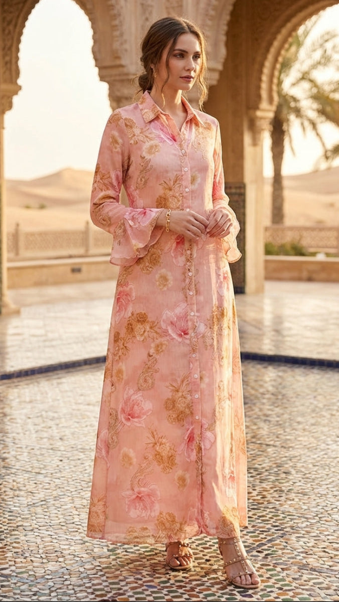 Woman in a floral dress standing in an architectural setting with arches and palm trees.