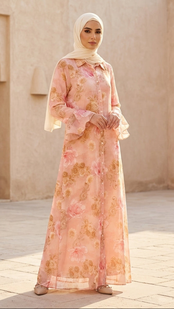 Woman in a floral dress standing in front of beige walls with arches