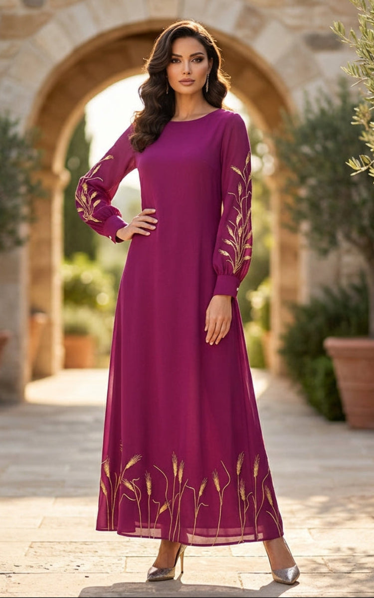Woman in a purple dress standing outdoors with stone archway and potted plants.