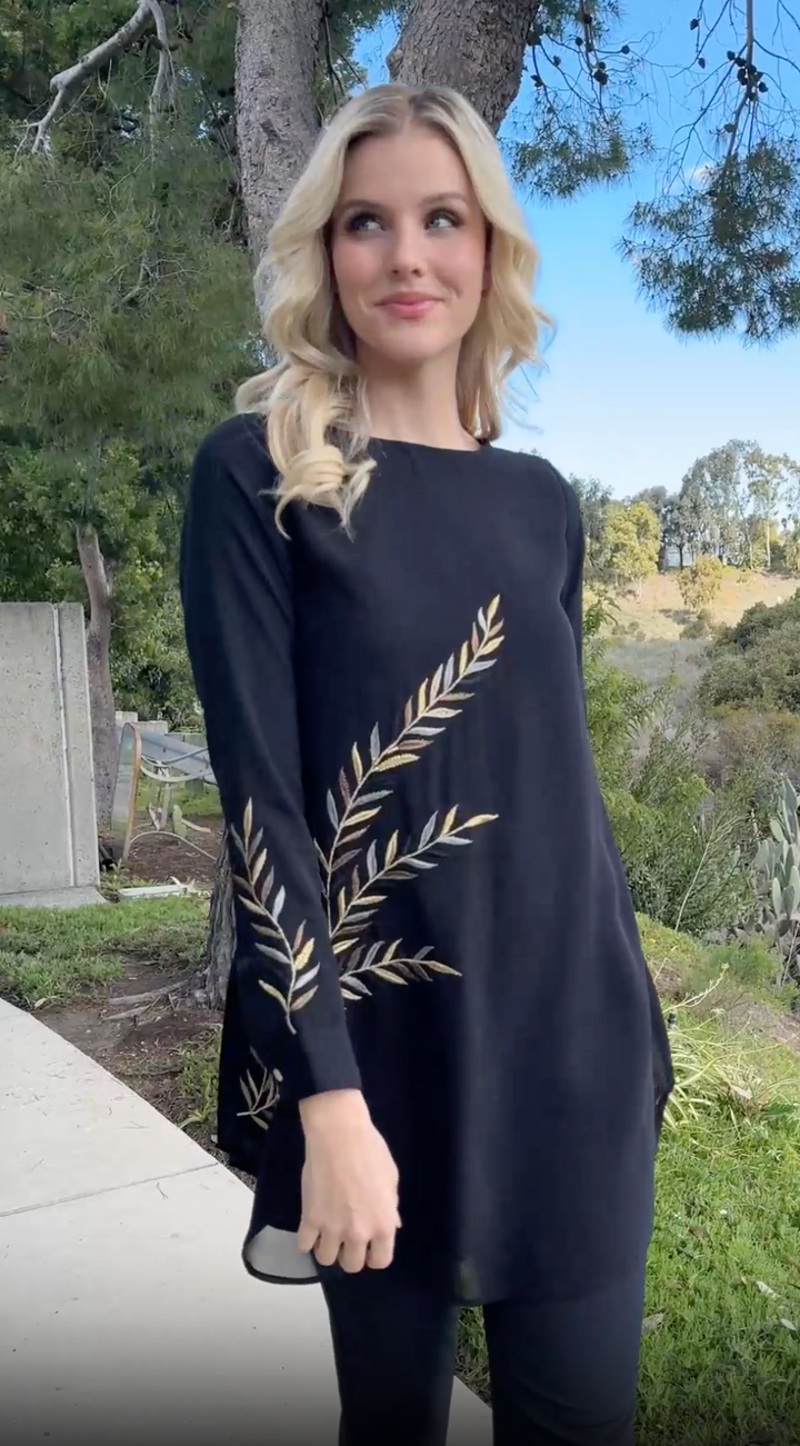 Woman outside wearing modest Baraka tunic in Black. 