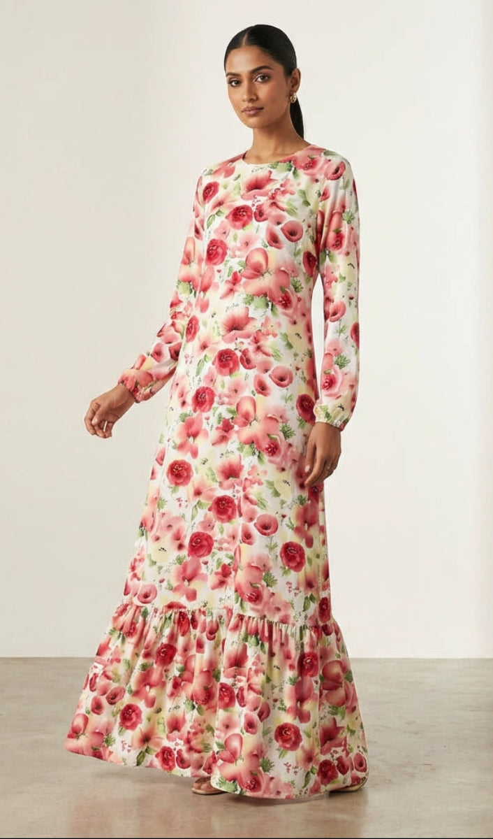 Woman wearing a floral dress against a plain background