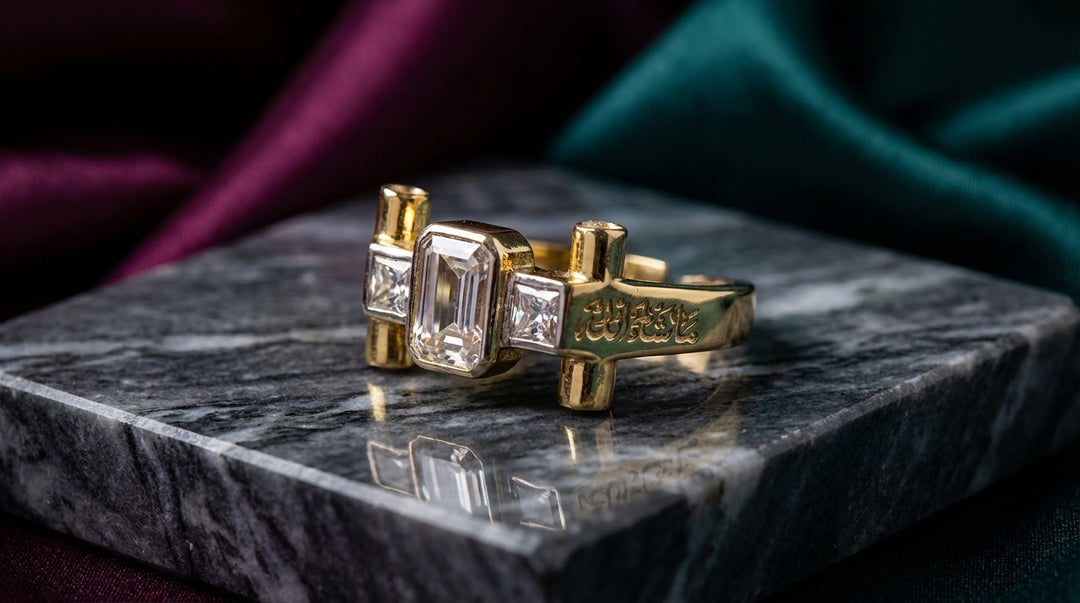 Two gold rings with diamond accents on a dark marble surface