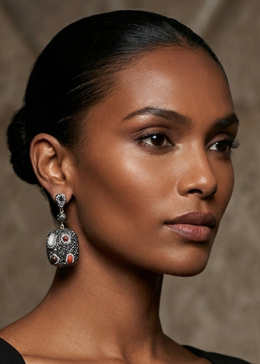 Woman wearing a black dress with a neutral background