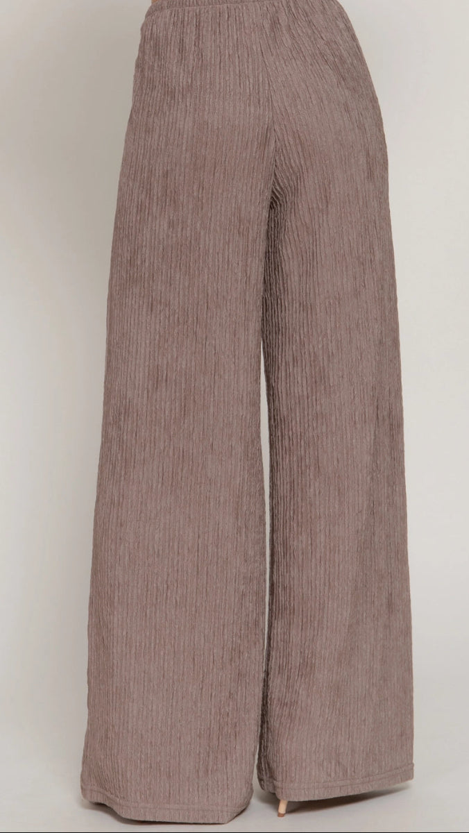 Brown wide-leg pants on a white background