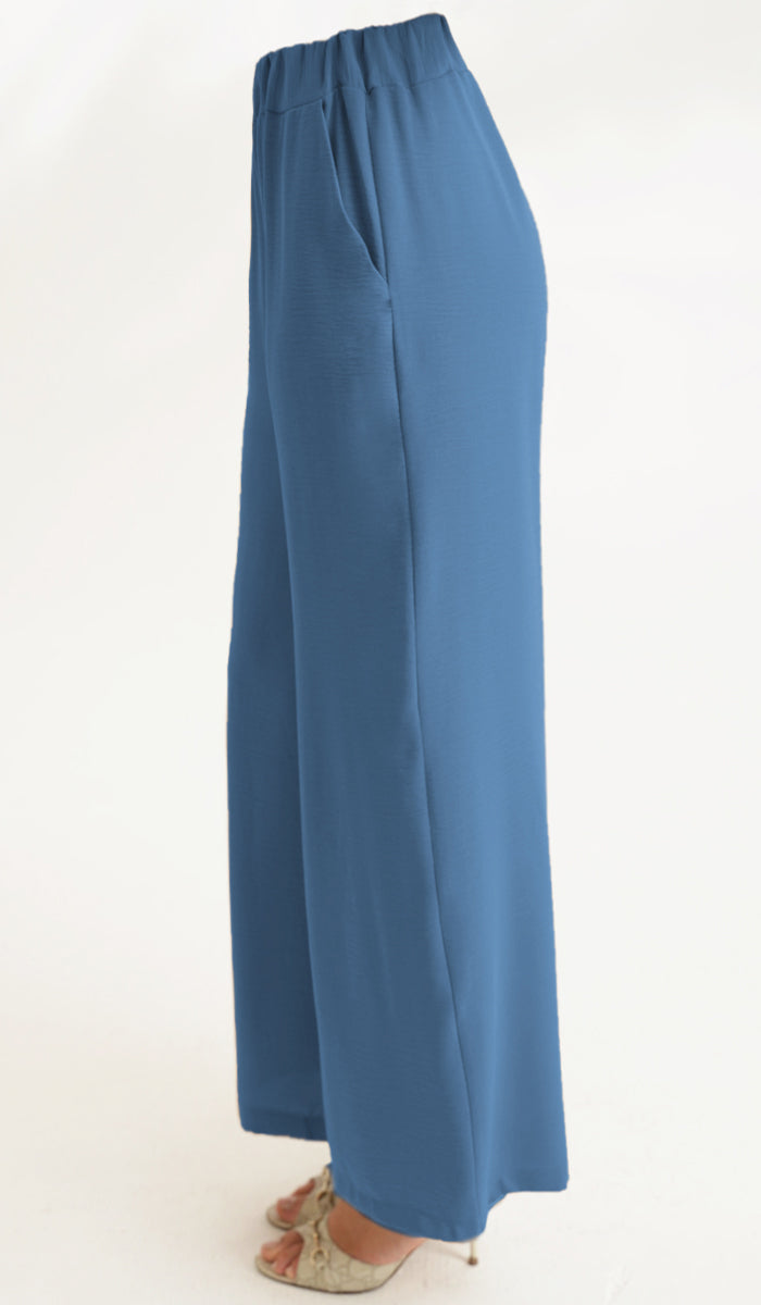 Blue wide-leg pants on a white background