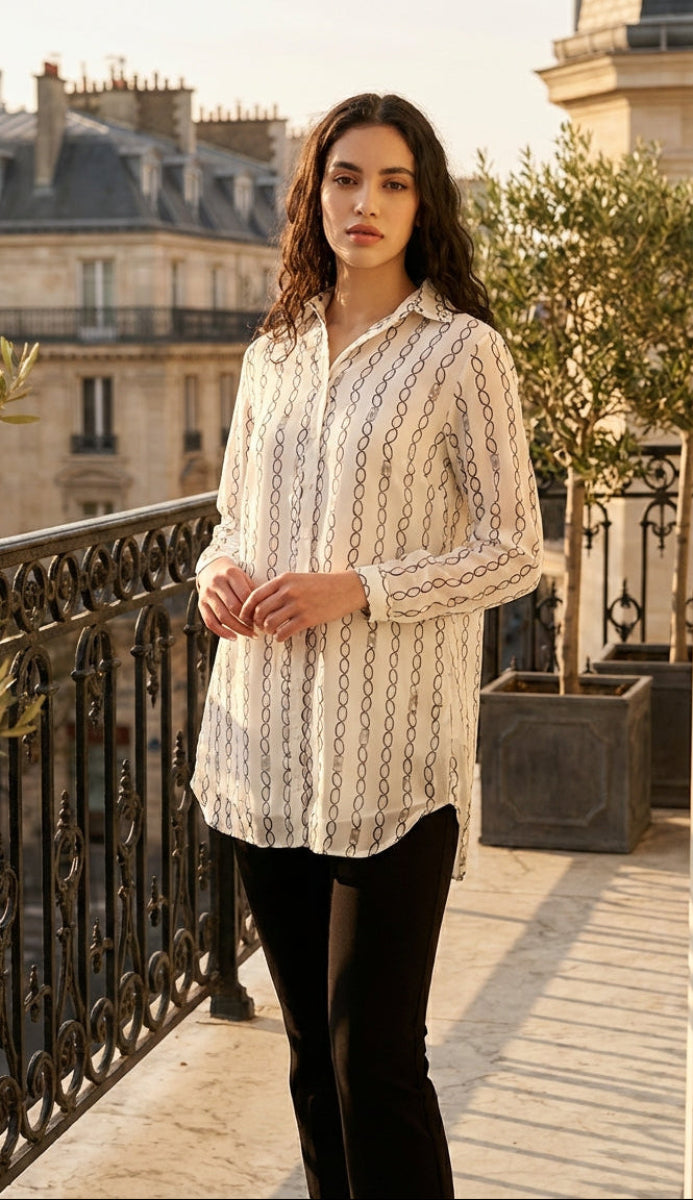 Woman standing on a balcony with a cityscape background