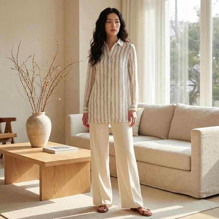 Woman standing in a modern living room with neutral decor