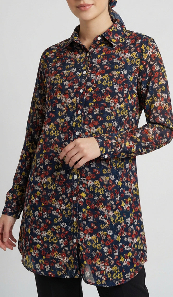 Floral patterned shirt worn by a person on a plain background