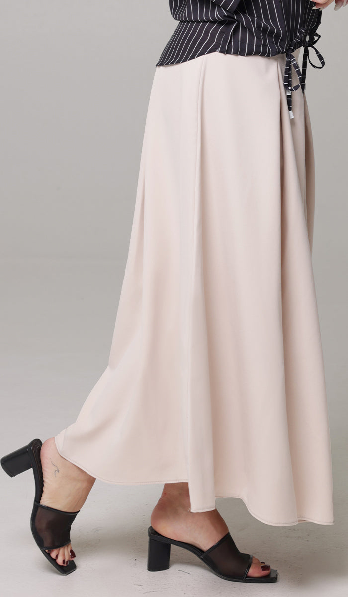 Side view of woman wearing Mia skirt in Blush. 