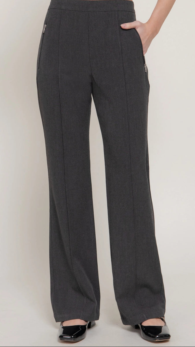 Black flare-leg pants worn by a person on a plain background