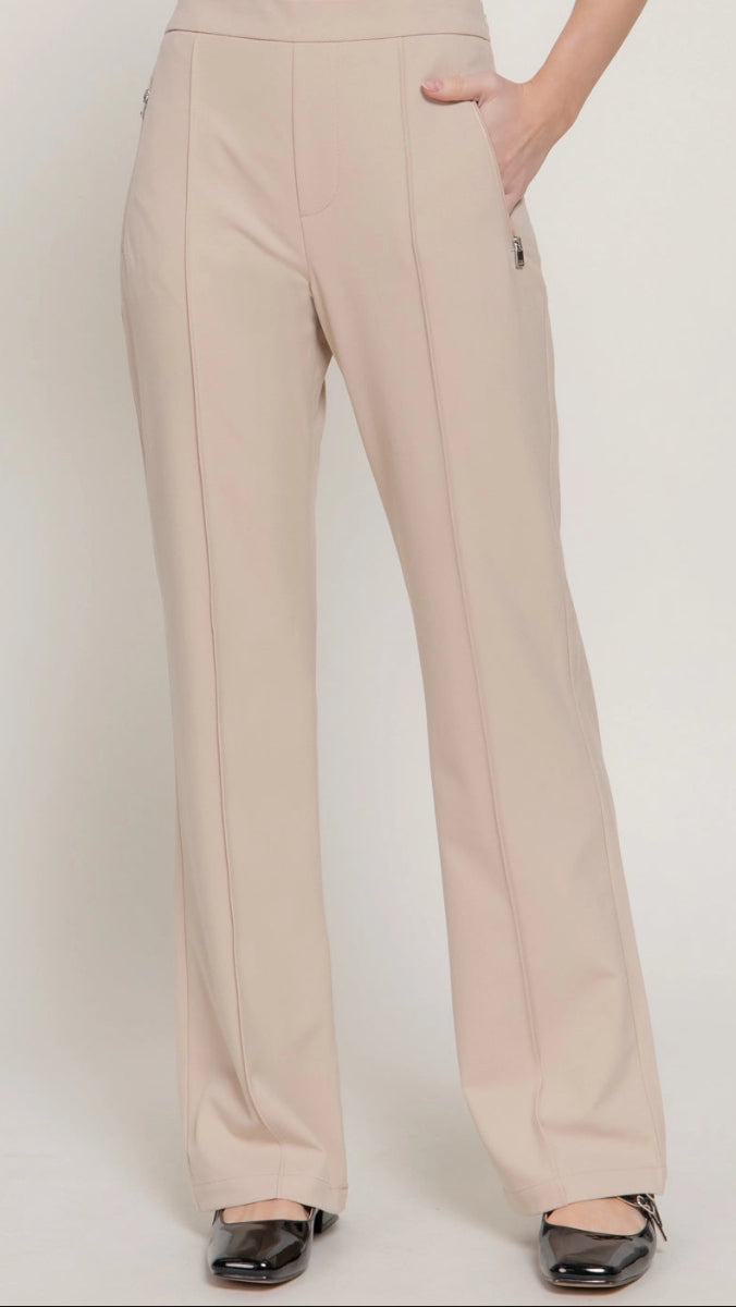 Beige pants worn by a person on a white background