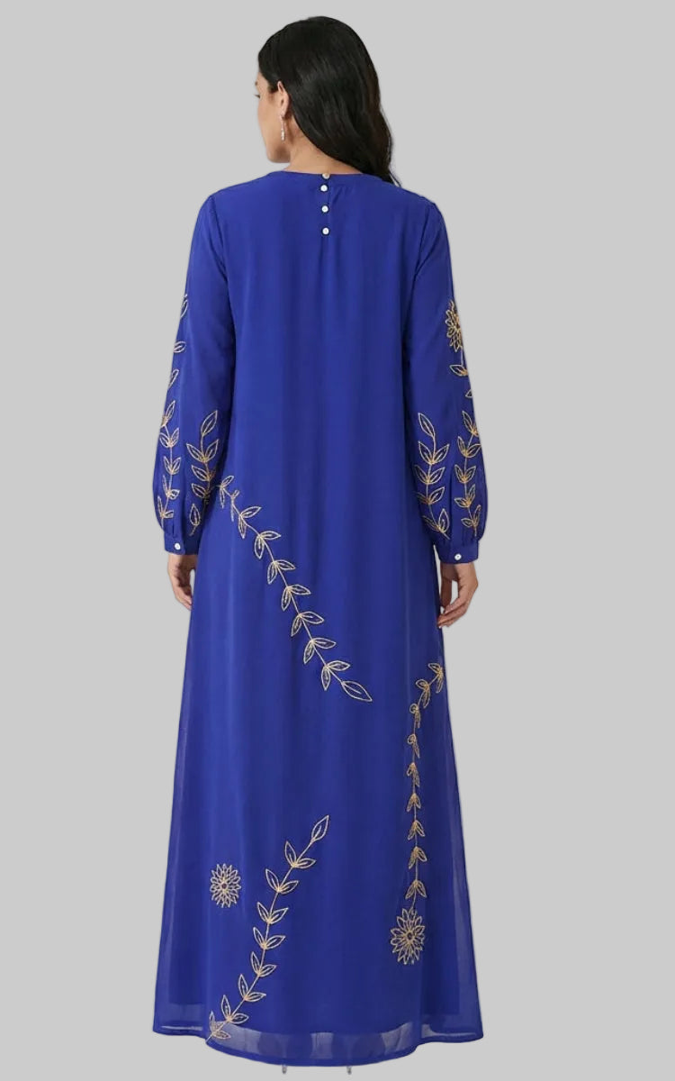 Blue dress with gold embroidery on a white background