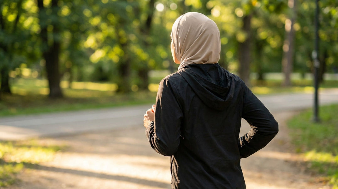 Person wearing a hijab running in a park