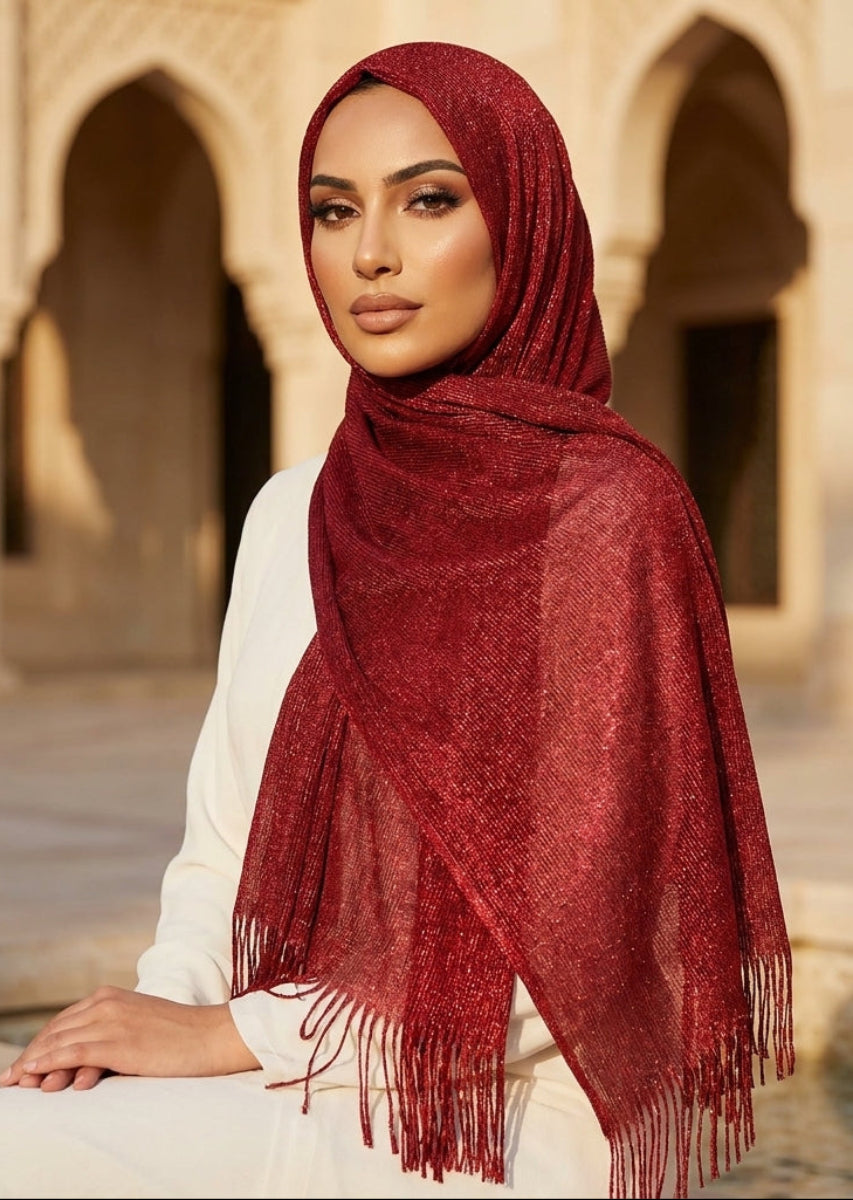 Woman wearing a red hijab in front of architectural arches