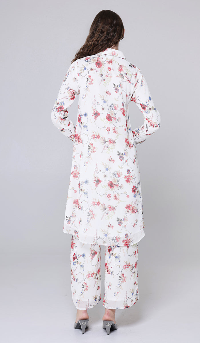 Woman wearing a floral pajama set on a plain background