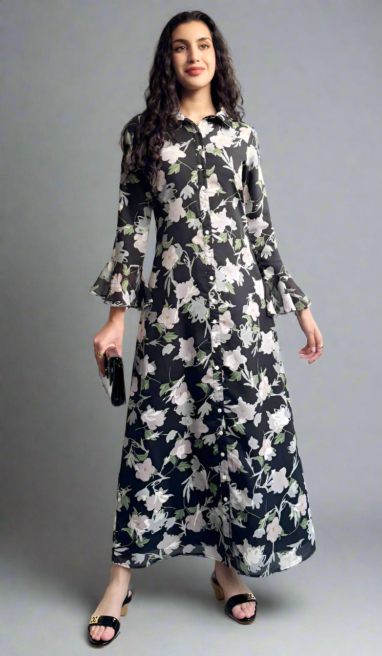 Woman wearing a floral dress standing against a plain background