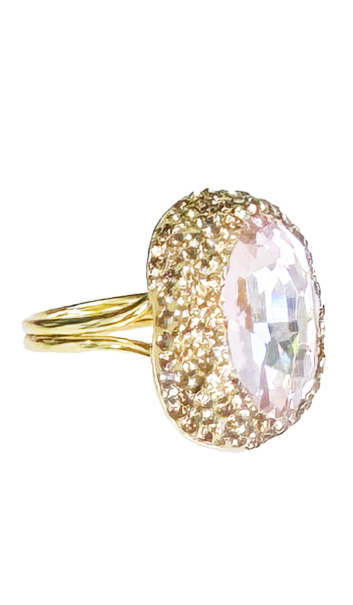 side profile view of a oval hot pink jewel ring with gold shimmer crystals.
