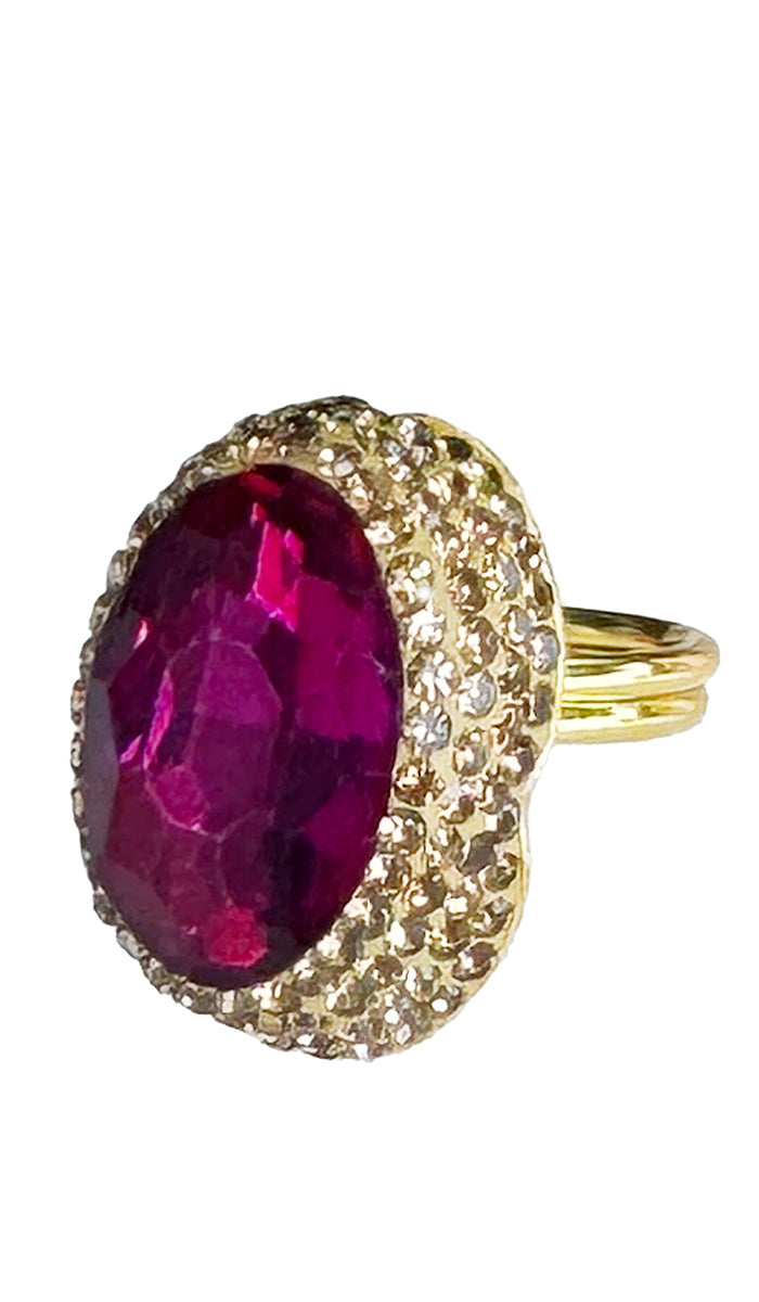 side view of oval hot pink jewel ring with gold shimmer crystals.