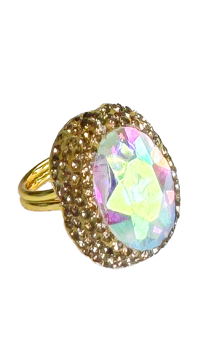 side view of iridescent oval ring with gold shimmer crystals.
