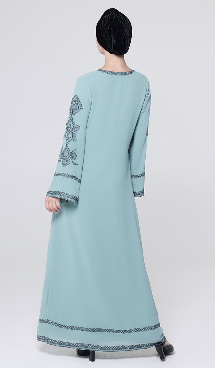 Light blue dress with embroidery on a white background