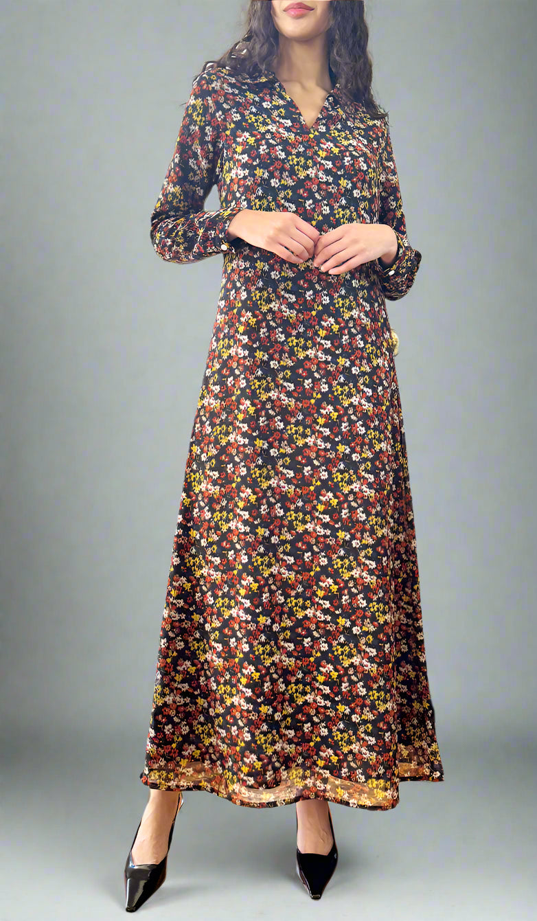 Woman wearing a floral dress standing in a room with a piano and a door leading outside.