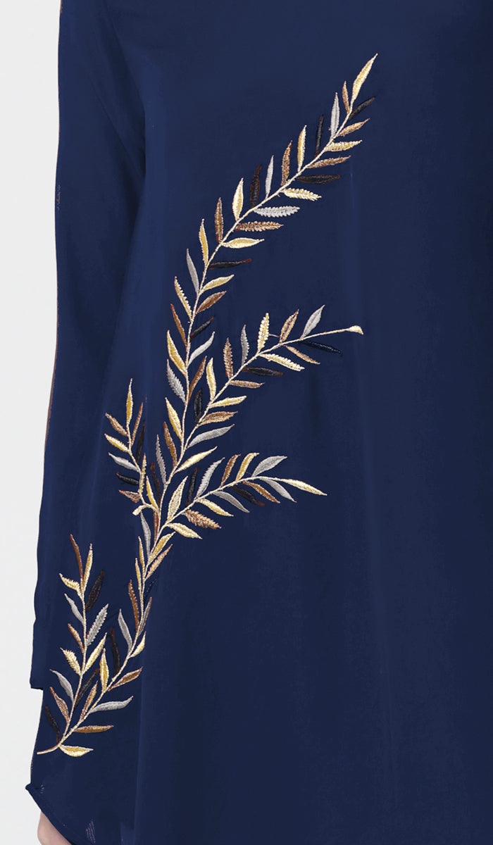 Details of embroidery on Baraka tunic in Sapphire. 