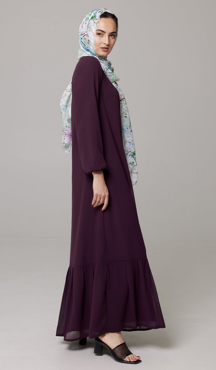 Woman wearing Batool dress in Mulberry with hijab. 