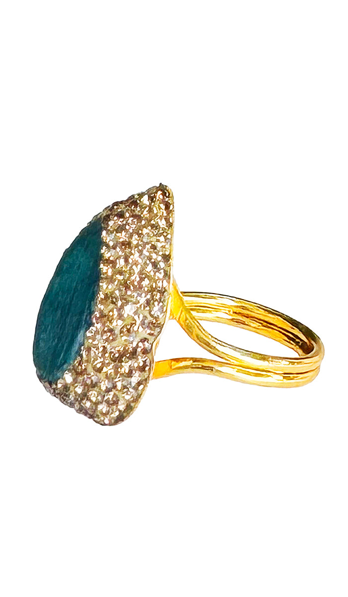 side profile of tear dropped emerald ring.