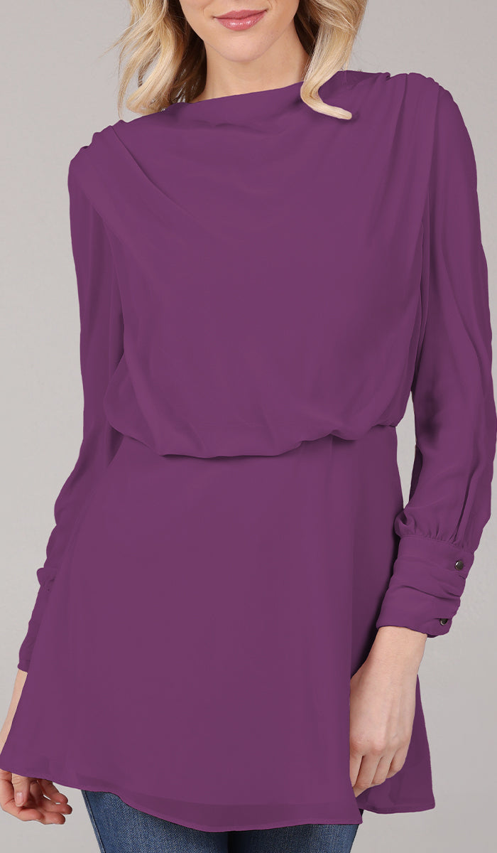 Smiling woman wearing modest Myra tunic in Orchid. 