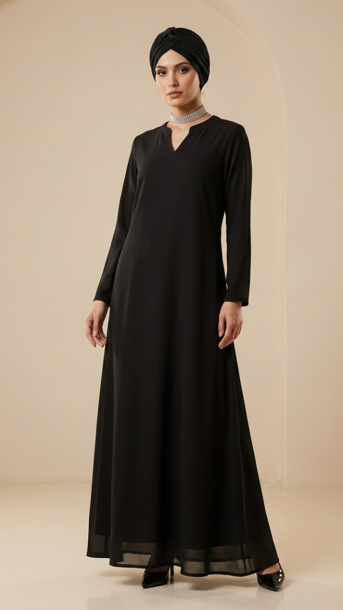 Woman wearing a black long-sleeve dress and headscarf against a beige background