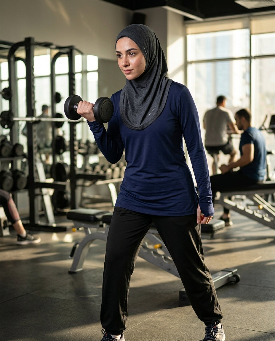Woman lifting weights in a gym setting