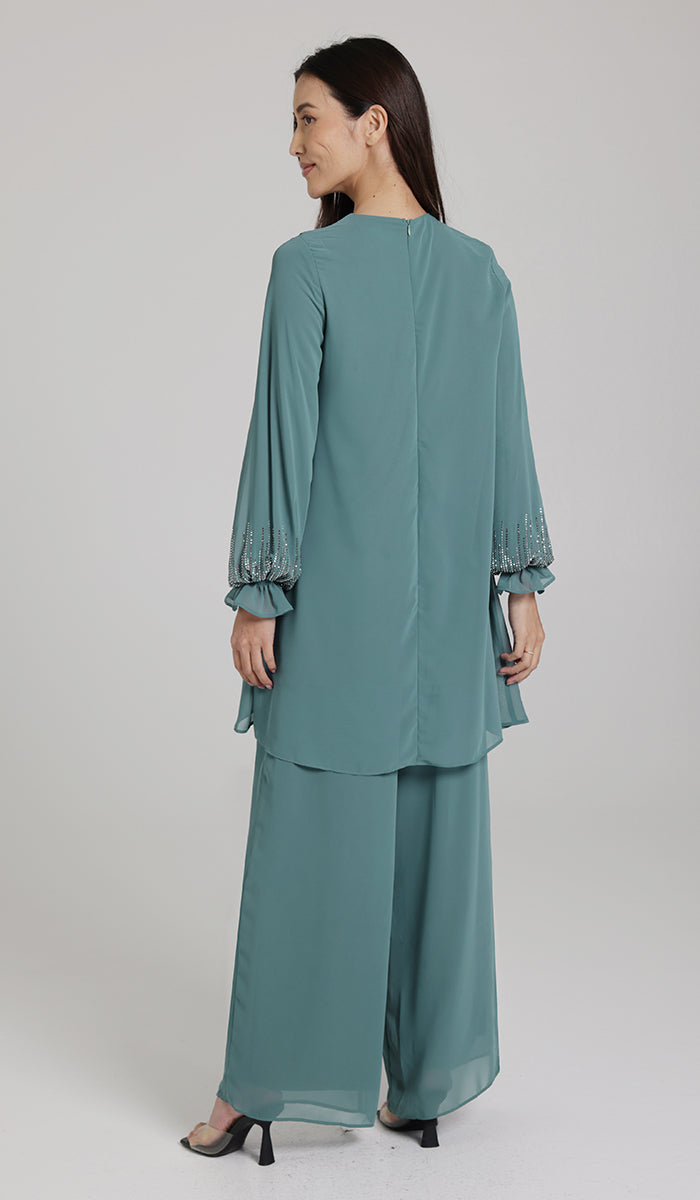 Back view of woman wearing Seema tunic. 