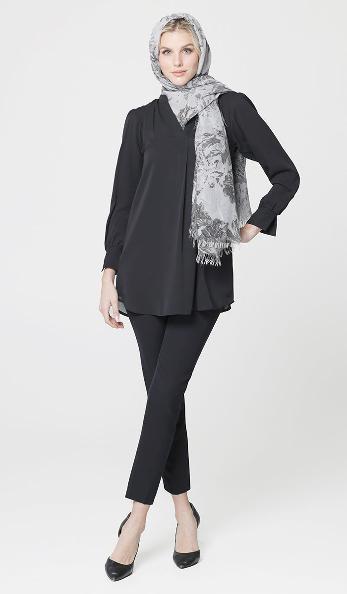 Woman wearing gray cotton abstract hijab with Shaina tunic in Black with black pants and heels. 