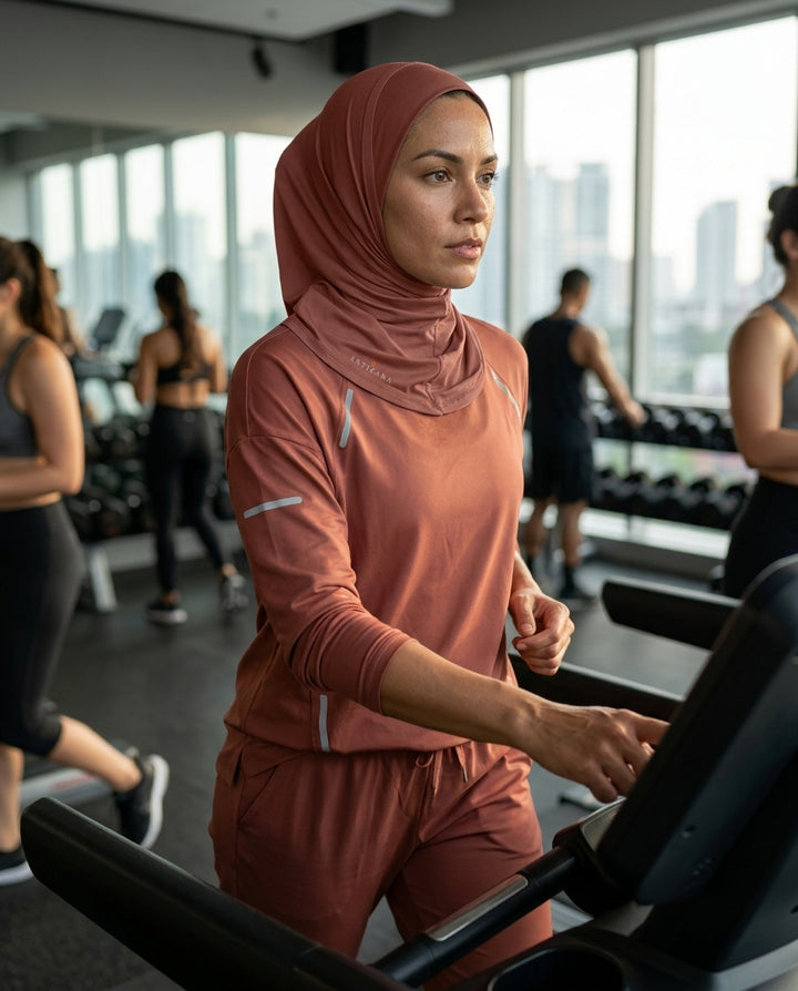 Woman exercising on a treadmill in a gym with a cityscape view