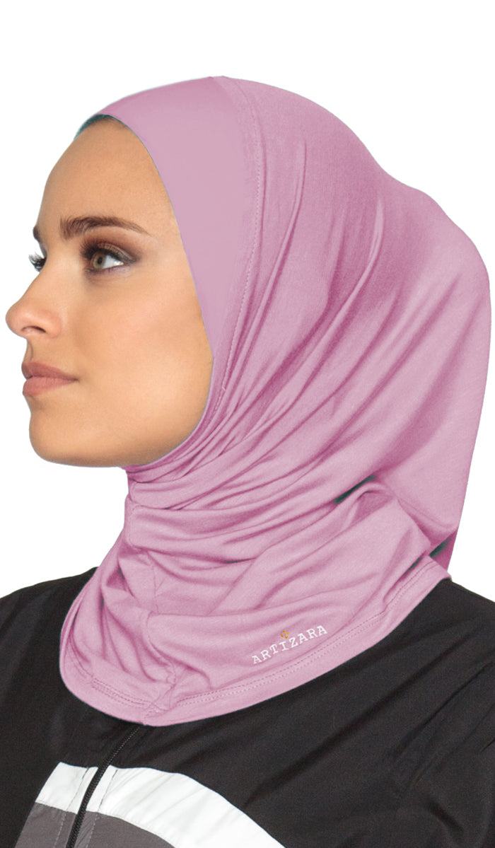Woman wearing a pink hijab with a visible brand logo on a white background