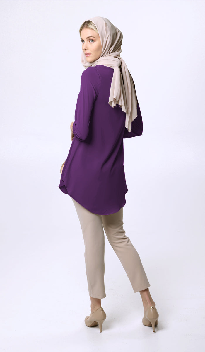 Back view of woman wearing Suroor tunic in Dark Purple. 