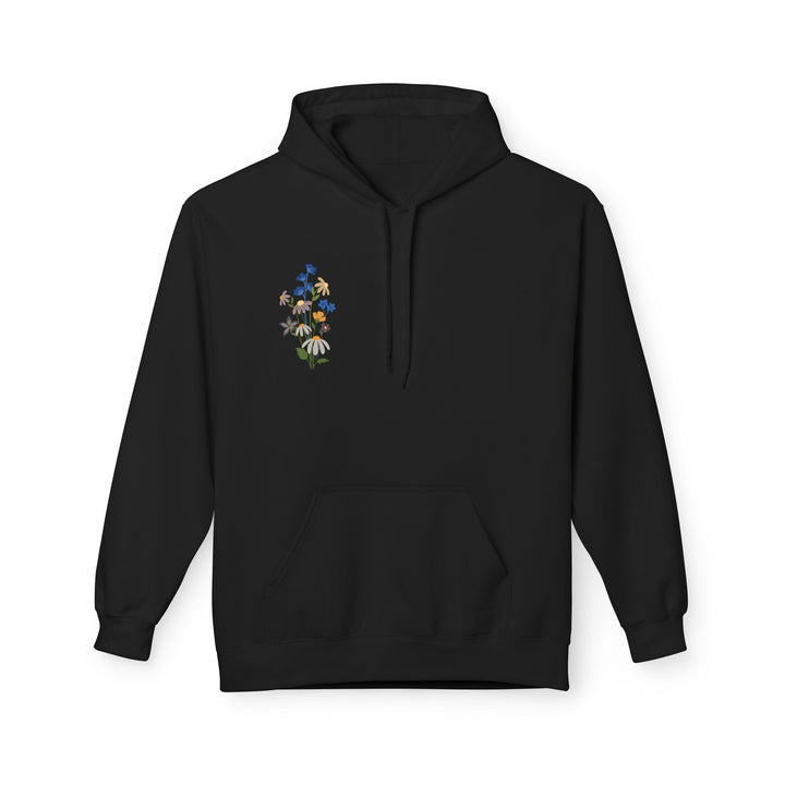 A white fleece hoodie with Arabic calligraphy and a floral design on the back, modeled by a person facing away from the camera.