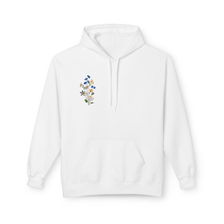 A white fleece hoodie with Arabic calligraphy and a floral design on the back, modeled by a person facing away from the camera.