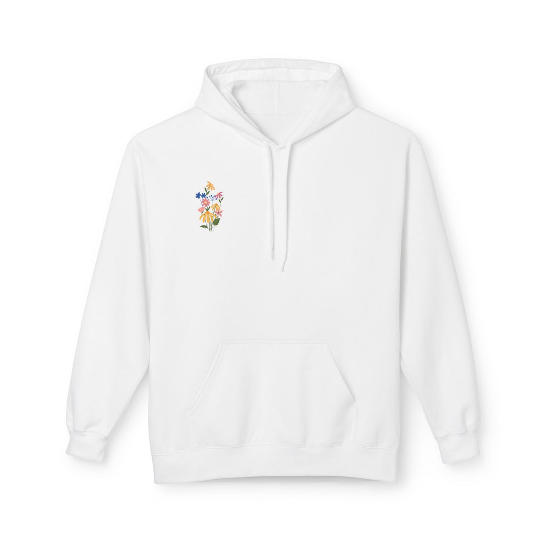 A pink fleece hoodie with Arabic calligraphy and a floral design on the back.