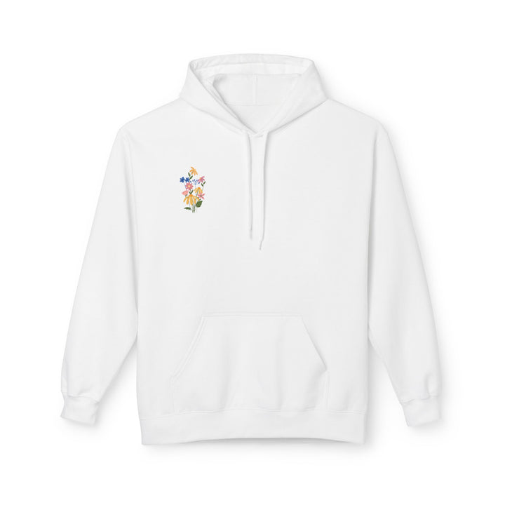 A pink fleece hoodie with Arabic calligraphy and a floral design on the back.